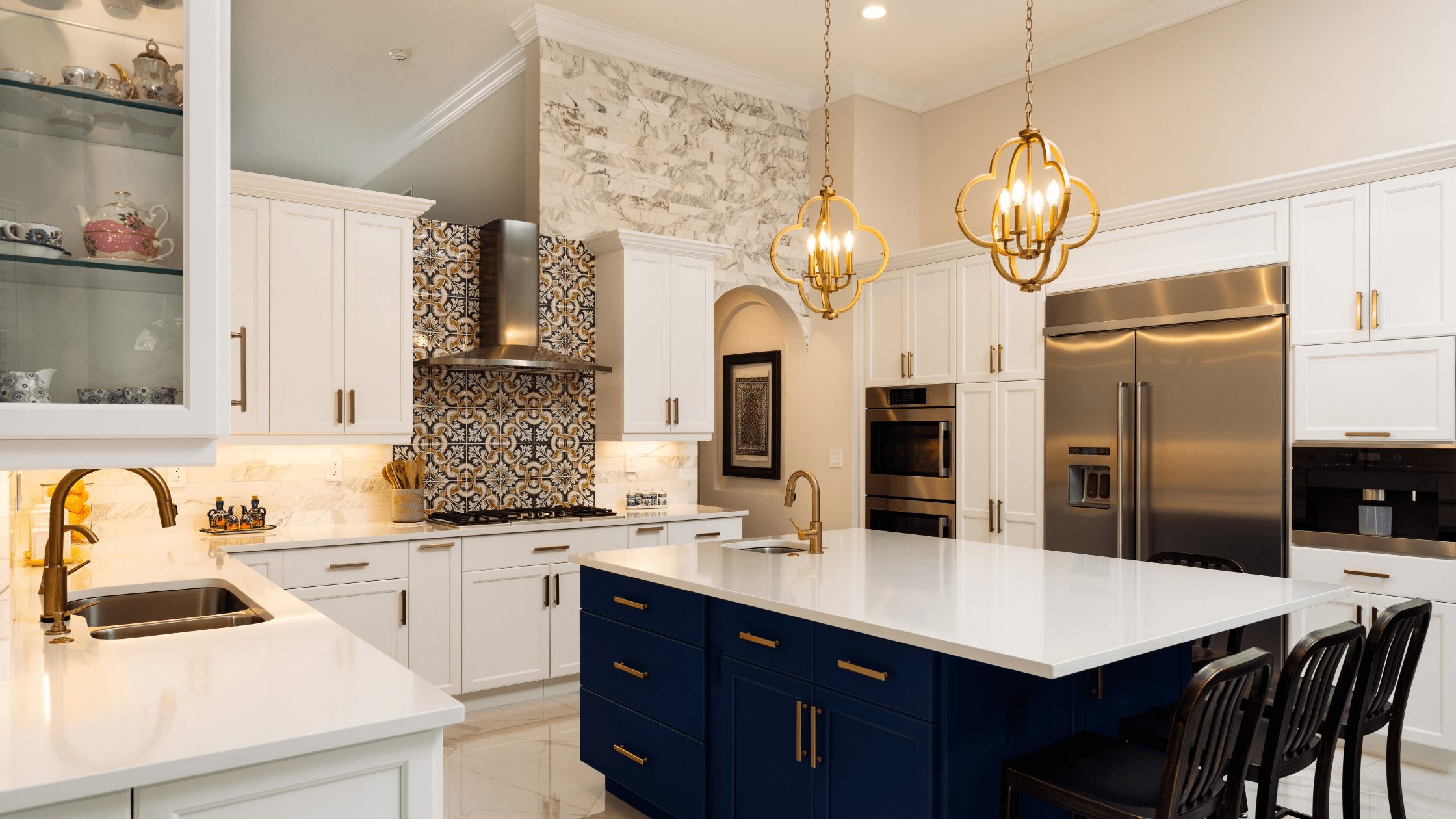 Kitchen with white cabinetry, a navy island, black counter stools and a patterned backsplash behind the range.