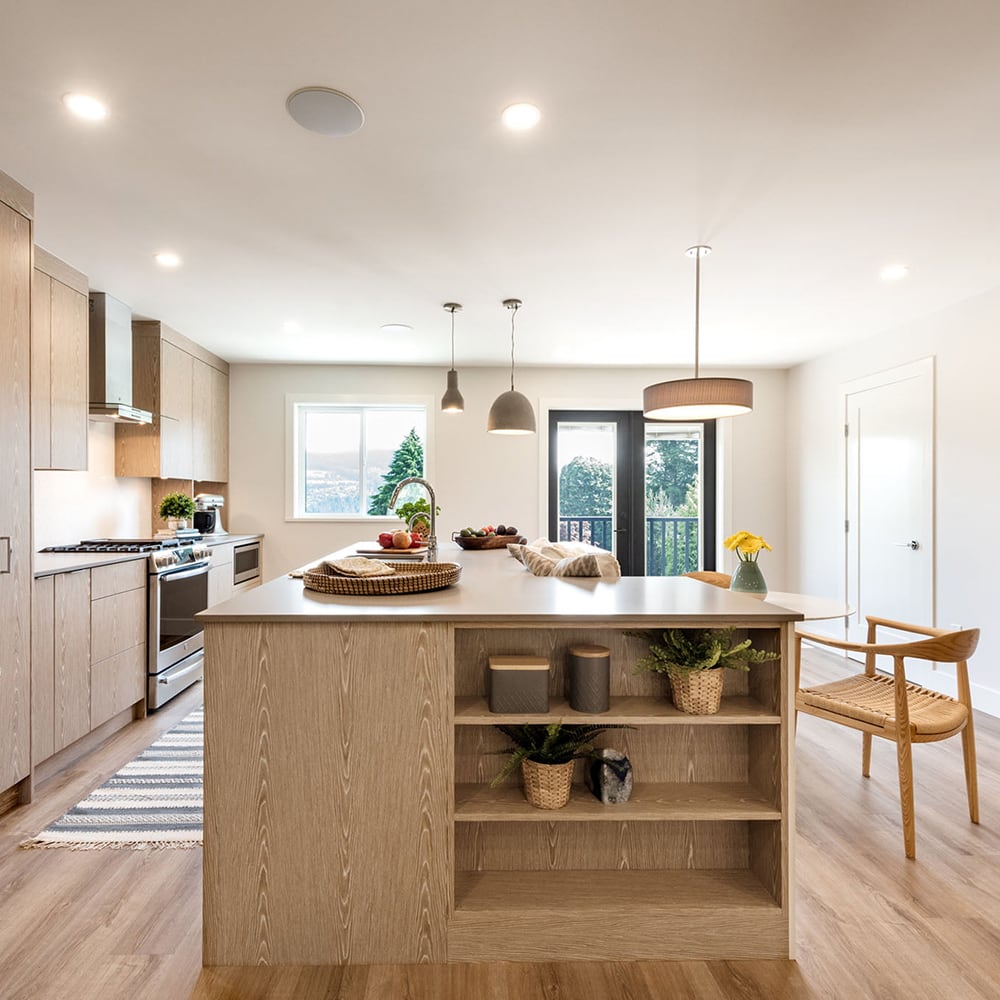 Steam Funk kitchen with wood cabinetry and a central island with open display shelves